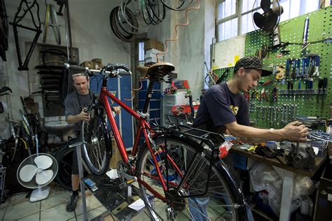 File Munich Two Men Working In A Bicycle Repair Shop